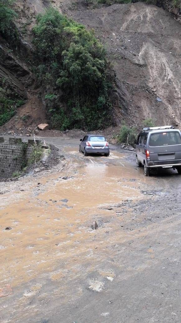 Vehicles are seen passing though a bridge near Kigwema along the National Highway-2 in this file photo taken in June, 2022. (Morung File Photo).